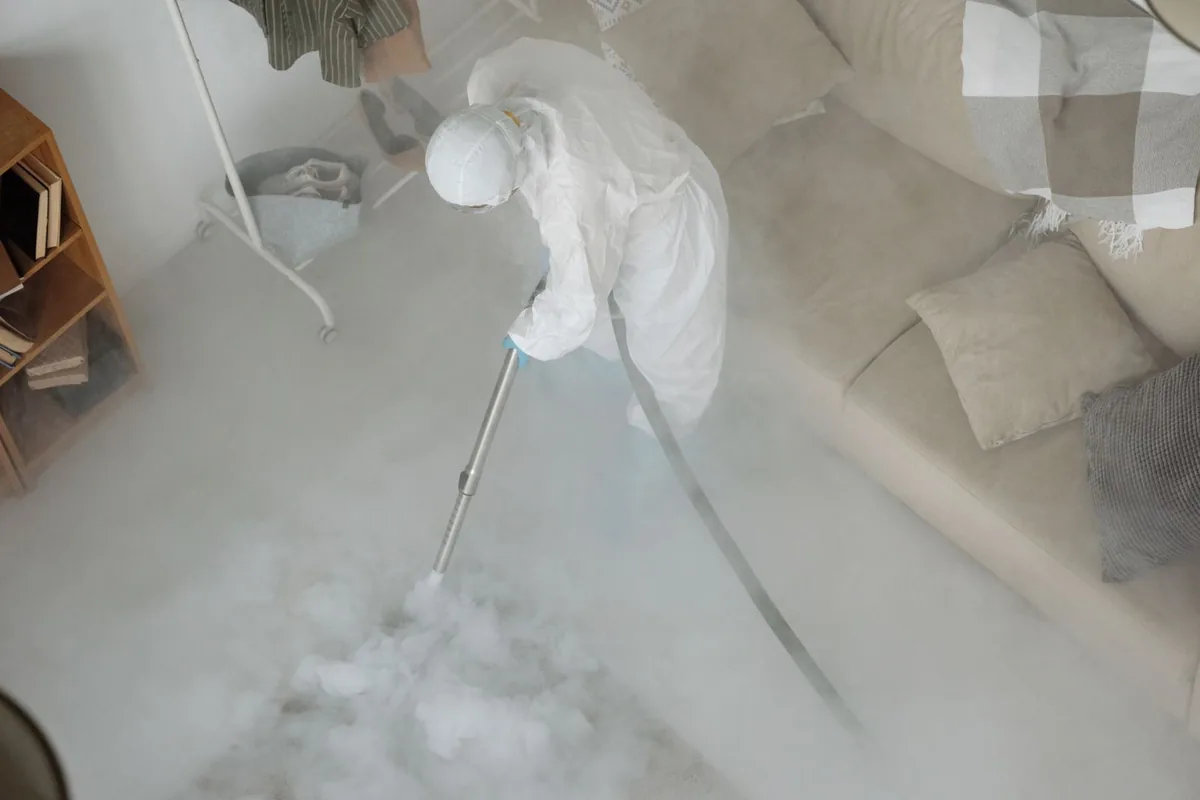 Biohazard cleanup technician in protective equipment, Gadsden, AL
